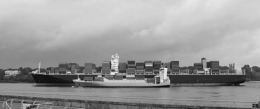 Two Container Ships from dtfferent Size Leaving the Port of Hamburg